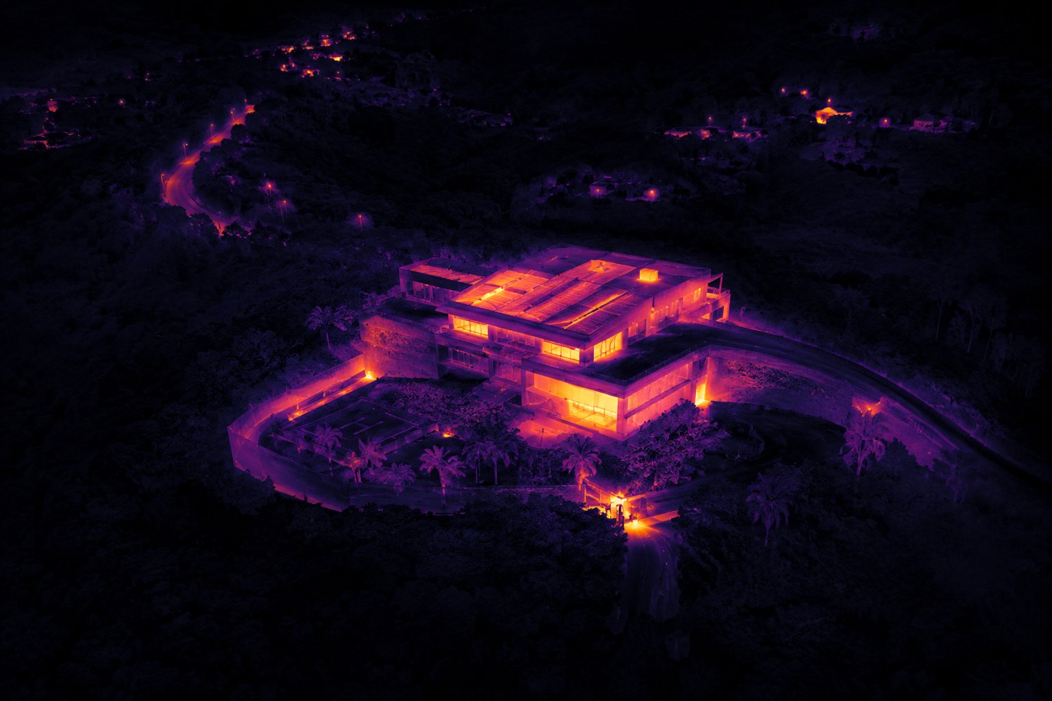 Thermal drone image of a modern flat-roofed building surveyed at dusk